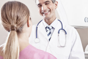 Doctor Laughing with a Patient